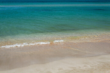 waves of beach, azure sea and white sand