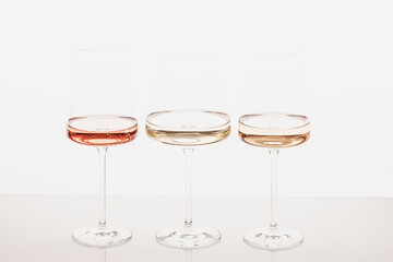 Three glasses of different white and rose wines