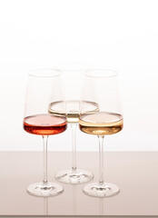 Three glasses of different white and rose wines