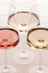 Three glasses of different white and rose wines