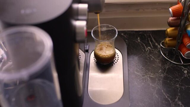 Espresso coffee being made in kitchen
