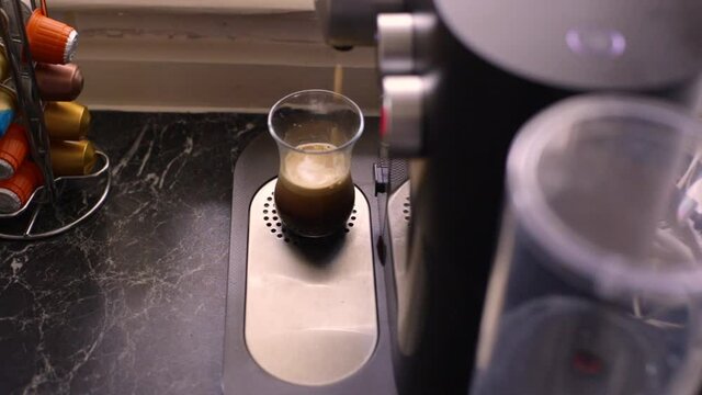Espresso coffee being made in kitchen