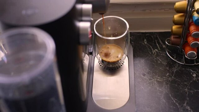 Espresso coffee being made in kitchen