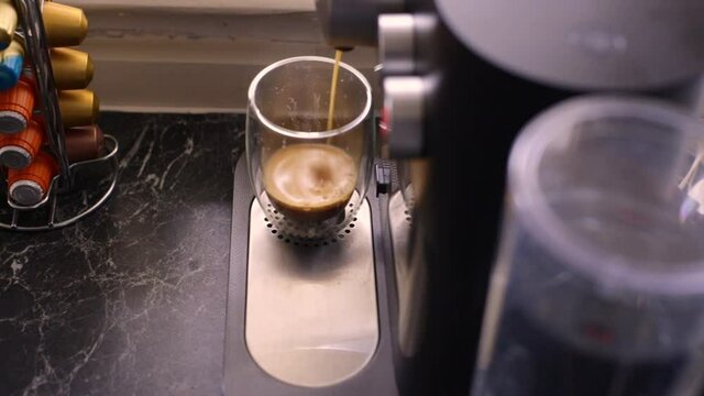 Espresso coffee being made in kitchen