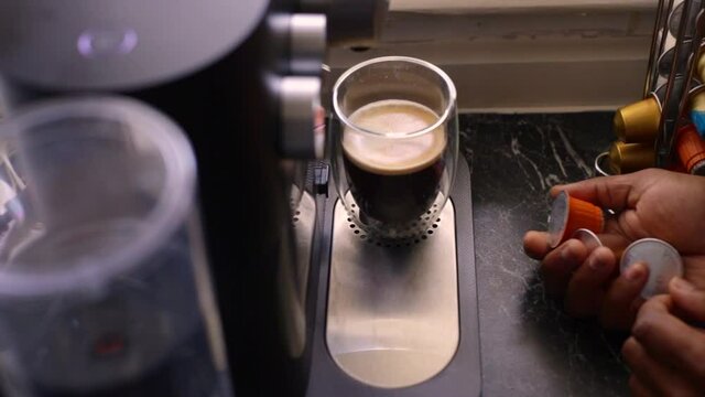 Espresso coffee being made in kitchen