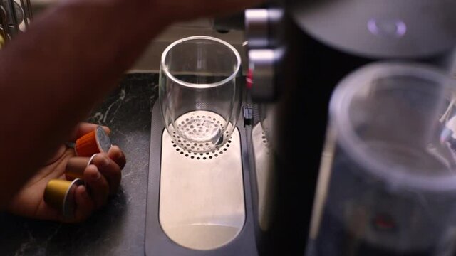 Espresso coffee being made in kitchen