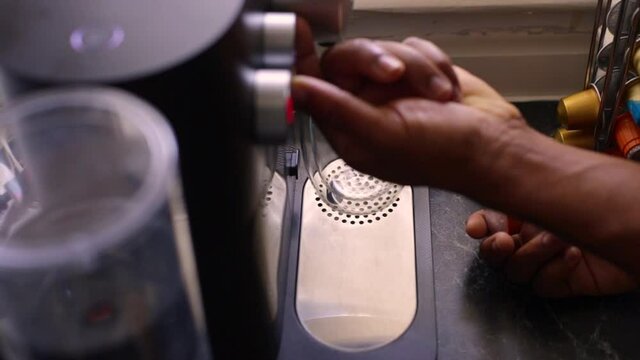 Espresso coffee being made in kitchen