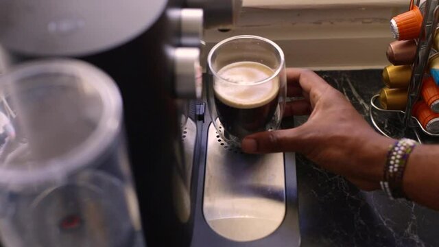Espresso coffee being made in kitchen