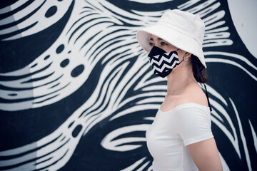Women wearing black and white masks, wearing hats, preventing germs, coronaviruses, Covid-19, a new...
