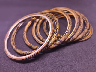 Multicolored Bangles on black background. Bangles are traditionally rigid bracelets, originating from the Indian subcontinent.