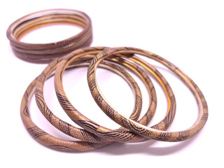 Fototapeta premium Multicolored Bangles isolated on white background. Selective focus. Bangles are traditionally rigid bracelets, originating from the Indian subcontinent.