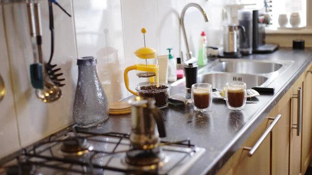 Top view person preparing bulletproof coffee with butter and MCT oil