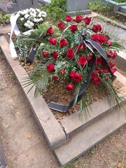 Funeral flowers on a grave in the cemetery