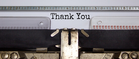 Text 'thank you' typed on retro typewriter. Business concept. Beautiful background.