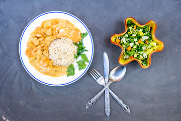 Curry dish with salad palte ready to be served