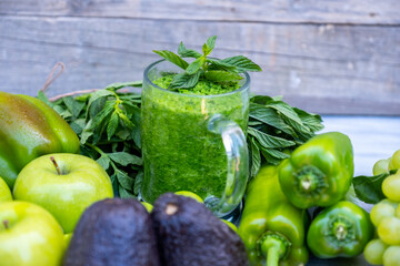 Different type of vegetables and fruits with healthy smoothie