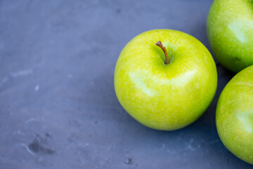 Three apples sitting next to each other