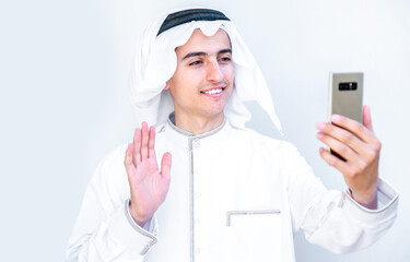 Arabic young man having online video call with his friends