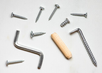 screws and bolts on white table 