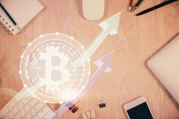 Double exposure of blockchain theme hologram over table with phone. Top view. Crypto technology concept.