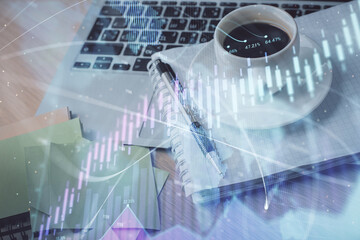 Double exposure of forex chart drawing and desktop with coffee and items on table background. Concept of financial market trading