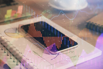 Double exposure of forex chart drawing and cell phone background. Concept of financial data analysis