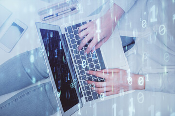Double exposure of woman hands working on computer and data theme hologram drawing. Top View. Technology concept.