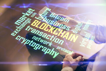 Double exposure of man's hands holding and using a phone and crypto currency blockchain theme drawing.