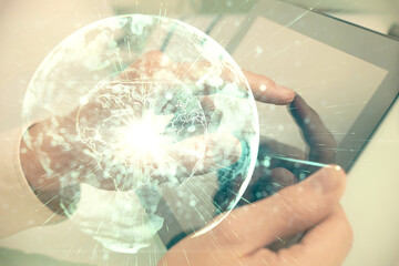 Double exposure of man's hands holding and using a phone and international business theme drawing.