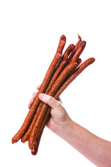 Man Holding Kabanos or Cabanossi Thin Dry Smoked Polish Sausage Isolated on White background. Selective focus.