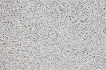 Texture of decorative plaster with a relief. White plaster. Close-up.