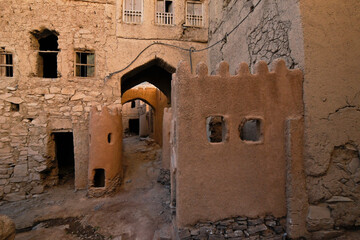 Crumbling mud-brick buildings in old section of Al-Hamra, Oman