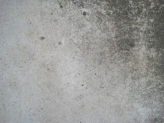 Close-up photo of a dirty concrete floor