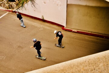 local boys skateboarding thru their neighborhood