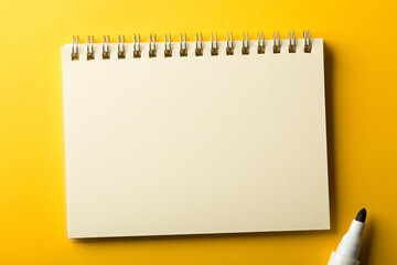 Blank Note Book On Yellow Background