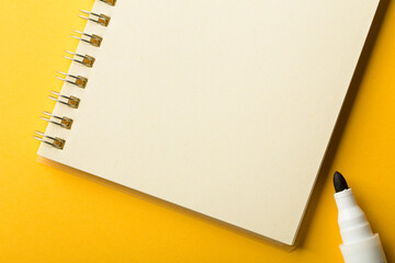 Blank Note Book On Yellow Background