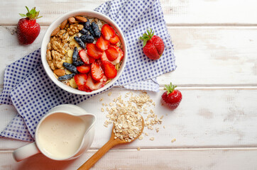 Homemade muesli bowl with strawberry, banana, nuts