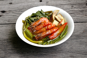 Filipino food called Sinigang na Hipon or shrimp in tamarind soup with vegetables