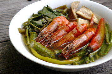 Filipino food called Sinigang na Hipon or shrimp in tamarind soup with vegetables
