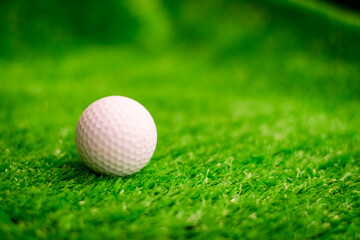 Golf ball on green grass
