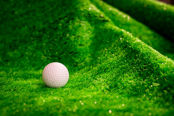 Golf ball on green grass