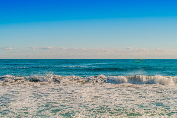 Fototapeta na wymiar Seascape of whitecaps and blue sky