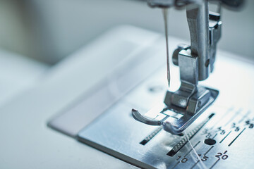 Close-up of sewing machine and sewing needle in fashion design studio