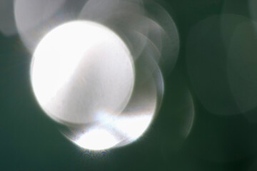 Bokeh blur with natural sunlight, used as background.