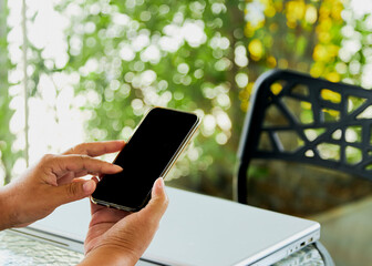 woman using mobile smart phone and notebook