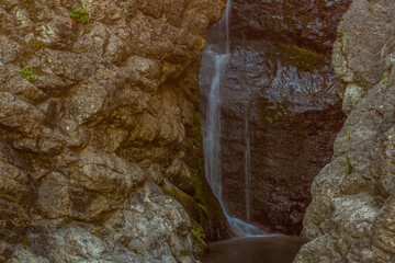 Waterfall cascading down granite wall