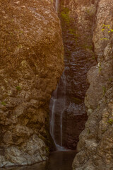 Waterfall cascading down granite wall