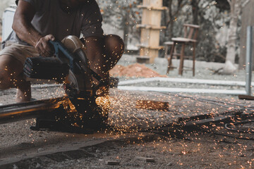 worker cutting metal