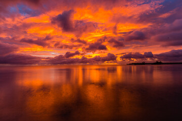 Fototapeta na wymiar Beautiful sunset over ocean water