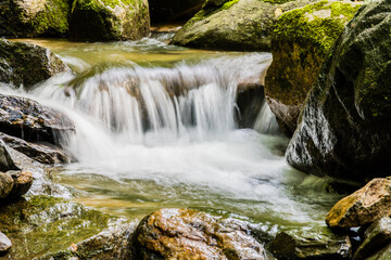 Fototapeta premium Waterfall in small mountain stream.